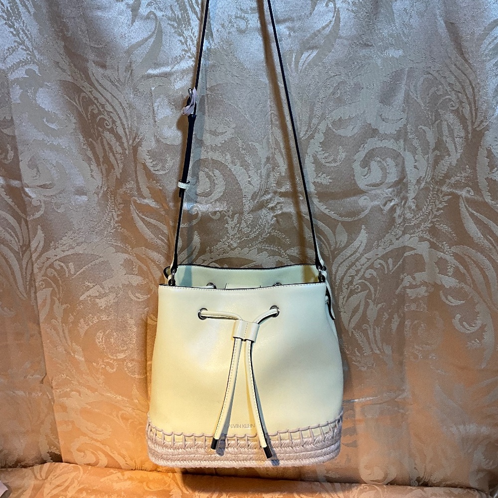 Calvin Klein - Yellow bucket bag with Bohemian detailing.   A1B